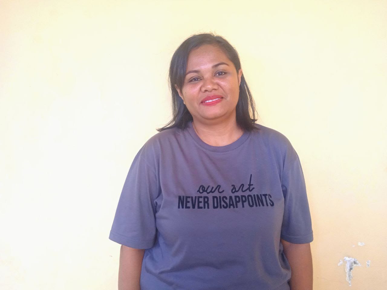 sri Sri Lestari Kouanak (40), seorang peserta Jaminan Kesehatan Nasional (JKN) dari segmen Pekerja Penerima Upah (PPU)